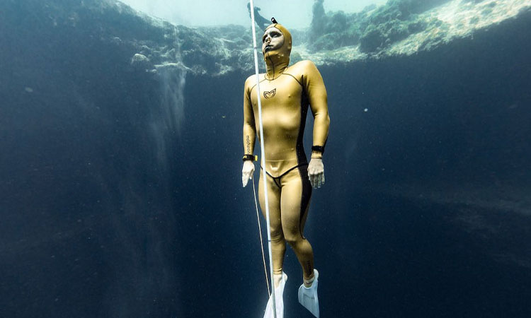 Uncovering the Man Behind The Golden Wetsuit